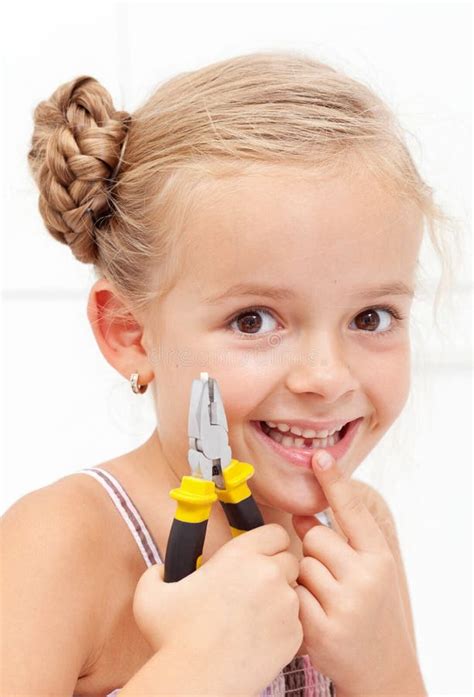 Little Girl Smiling Holding Her Missing Tooth Stock Photo - Image: 26413488