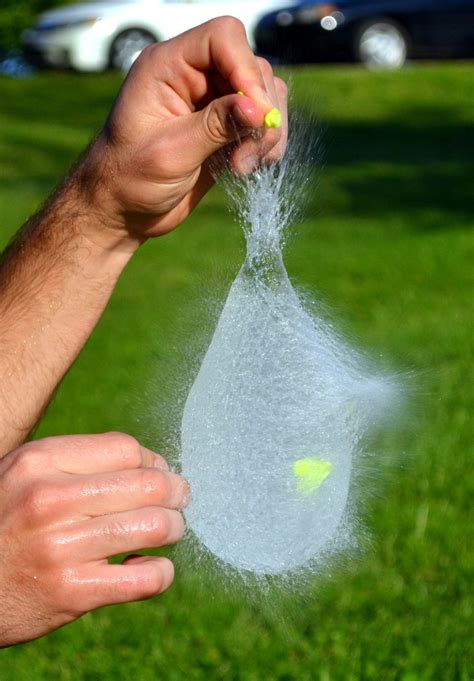 Having fun popping water balloons! :)