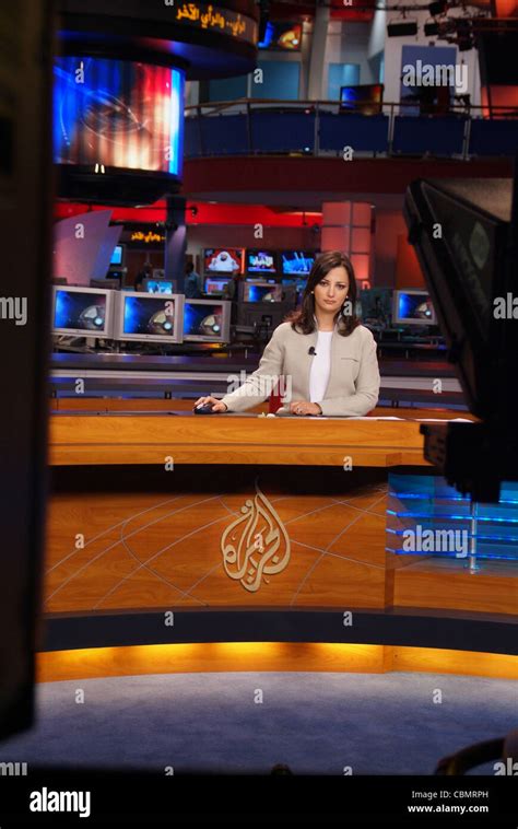 Al Jazeera TV (arabic channel) news anchor Ghada Oueiss read a news bulletin live from Doha ...