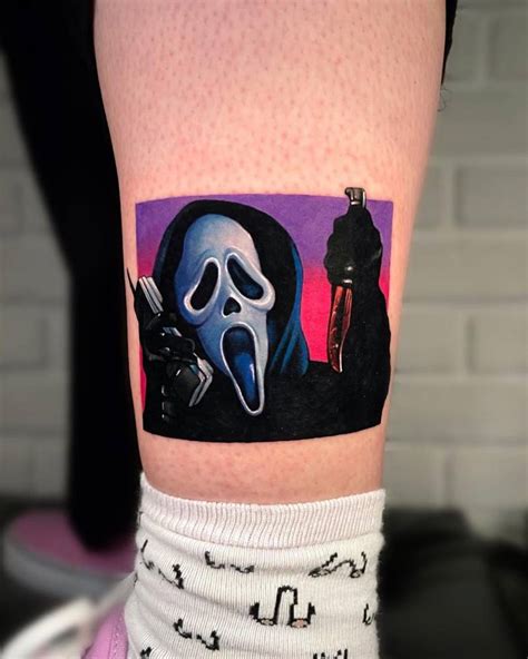 Scream tattoo located on the shin.