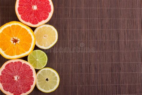 Citrus Fruits Cut Background- Oranges, Lemons, Limes, Grapefruit On A Wooden Background Stock ...