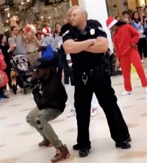 Officers pretend to break up flash mob, surprise shoppers audience by dancing