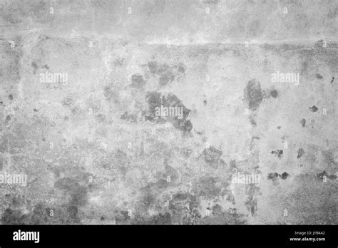 Weathered and aged concrete wall, paint peeled off. Texture background with vignetting in black ...