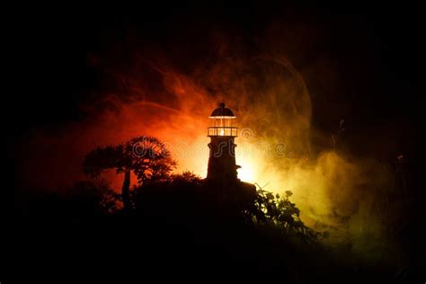 Lighthouse with Light Beam at Night with Fog. Old Lighthouse Standing ...