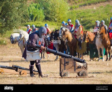 ALJUBARROTA, PORTUGAL - Aug 13, 2017: a man carrying cannon in a historical re-enactment of the ...