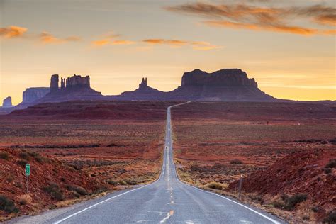 Country road leading towards mountains against blue sky – Fubiz Media