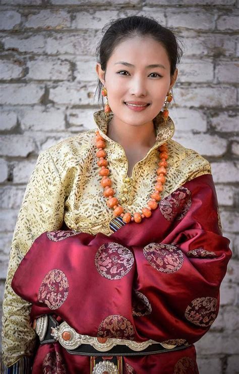 Tibetan woman in traditional festive costume of her region. with traditional jewelry | Beautiful ...