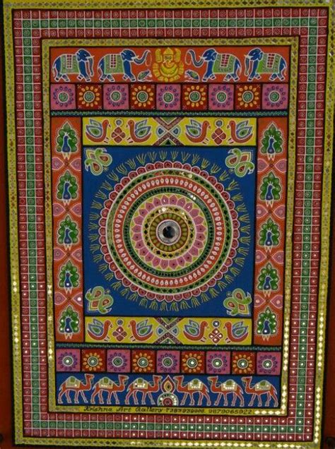 A traditional Gujarati artwork with mirror work on mud | Mandala design ...