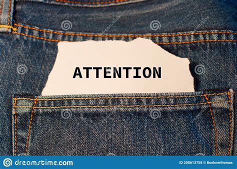 Label with Text Attention in the Pocket of Blue Denim Jeans. Stock ...