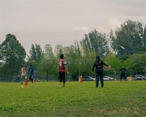 People Playing Frisbee Together at the Taman Tasik Cempaka Park Editorial Image - Image of ...