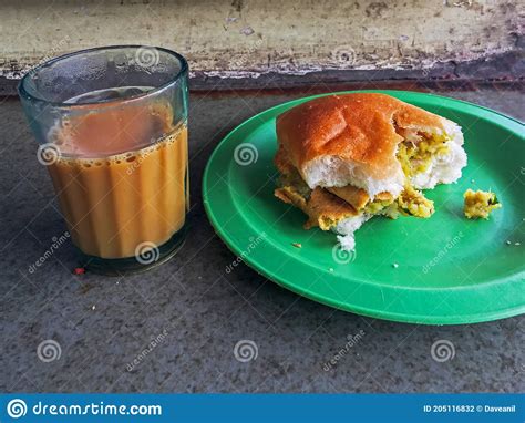 Vada Pav with a Glass of Cutting Tea, a Typical Snack in Mumbai Stock Photo - Image of typical ...