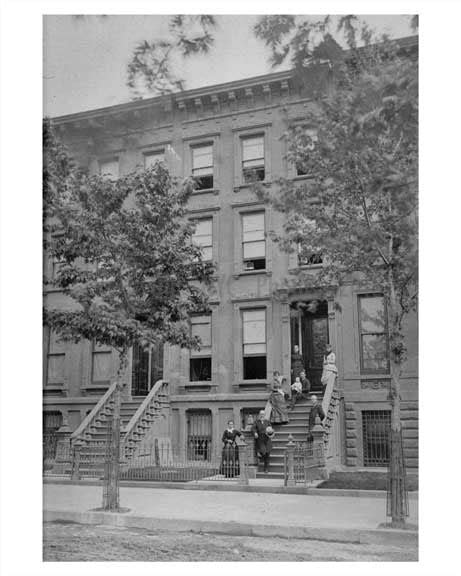 A family poses outside their building in Fort Greene Brooklyn — Old NYC Photos