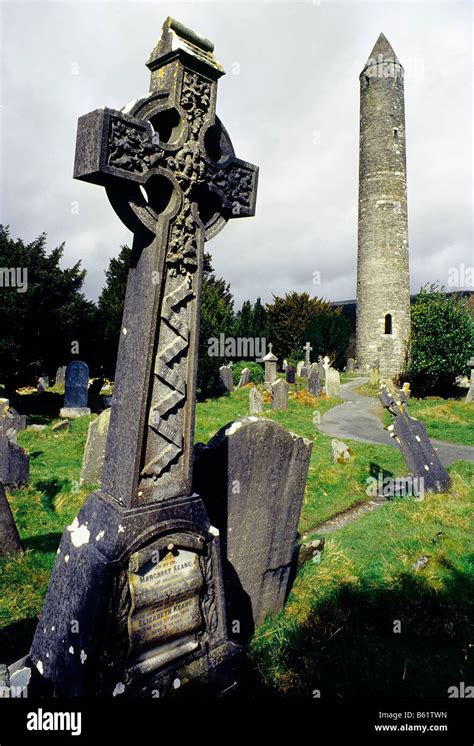 Glendalough, monastery ruins, round tower and celtic cross, grave yard, County Wicklow, Ireland ...