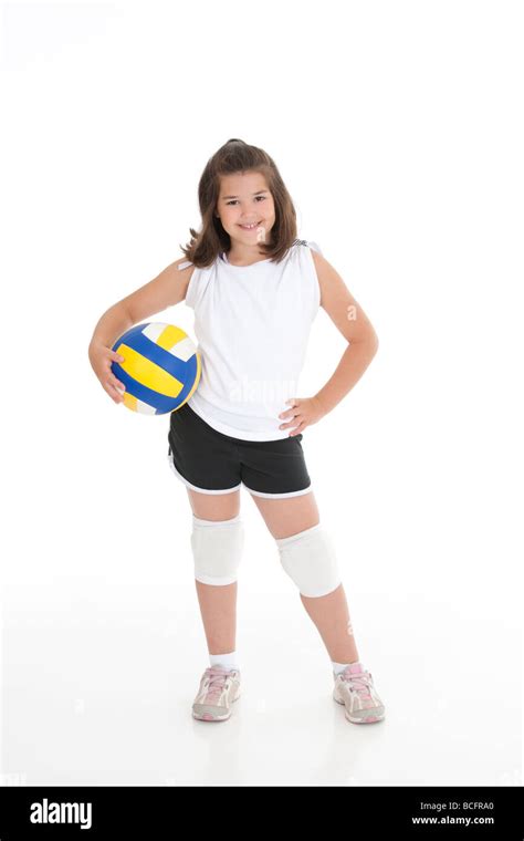 Portrait of a cute eight year old girl in volleyball outfit Stock Photo ...