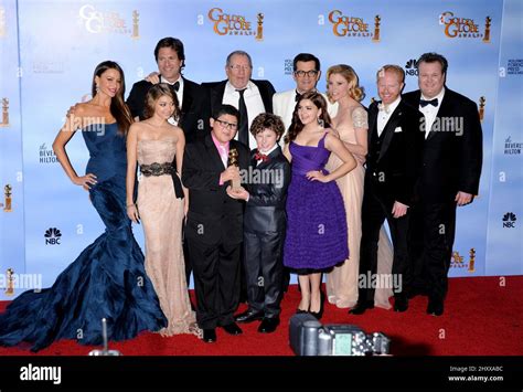 Cast of Modern Family poses in the press room at the 69th Annual Golden Globe Awards Ceremony ...