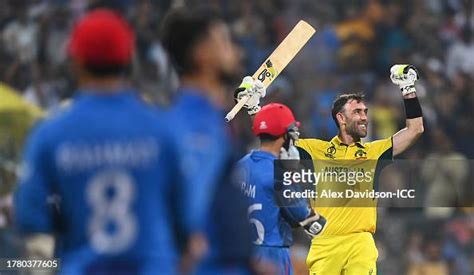 Glenn Maxwell of Australia celebrates after hitting a six for the ...