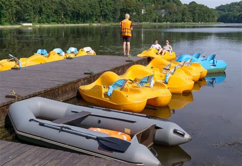 Parking pedalo on lake editorial photography. Image of boardwalk - 69115912