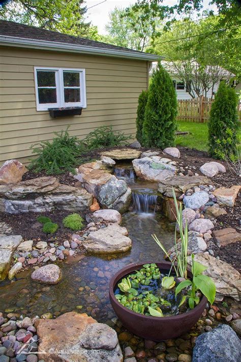 How a Pondless Waterfall Created an Outdoor Retreat | Small backyard ...