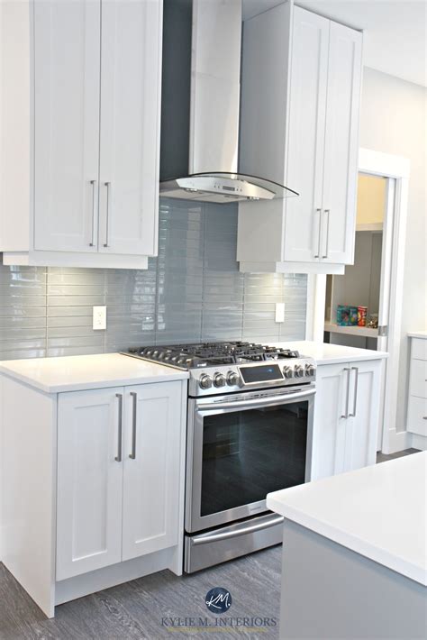 White shaker style cabinets, white quartz countertops, Coventry Gray island and Stonington Gray ...