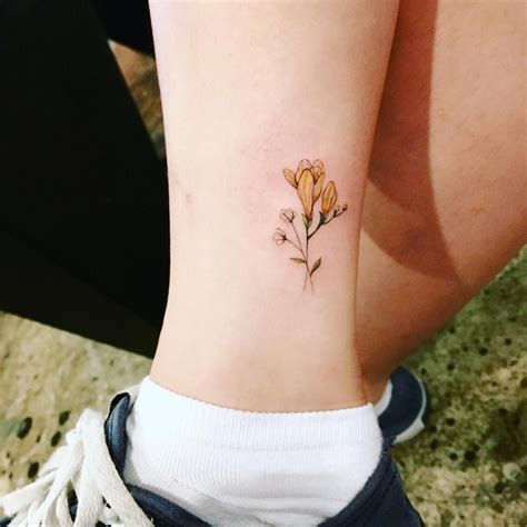 Freesia Tattoo by aeri_tattoo | Daisy tattoo, Tattoo designs, Daisy flower tattoos