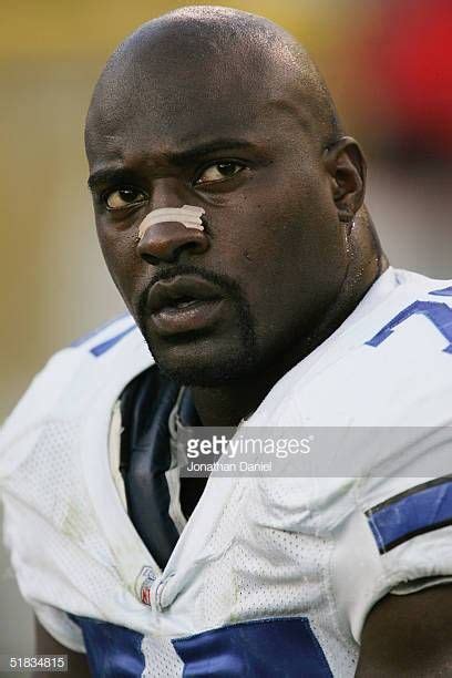 Defensive end Marcellus Wiley of the Dallas Cowboys looks on from the sideline during the game ...