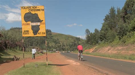 A sign marks the equator line in Kenya, Africa. Stock Video Footage - Storyblocks