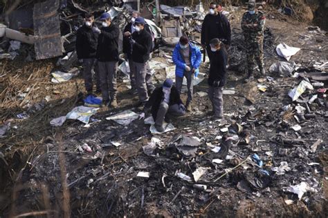 Relatives protest slow autopsy of Nepal plane crash victims