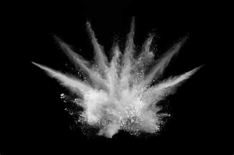 Premium Photo | White powder explosion on black.