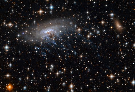 Hubble Telescope Captures Extraordinary Images of a Galaxy Being Torn Apart - The Phoblographer