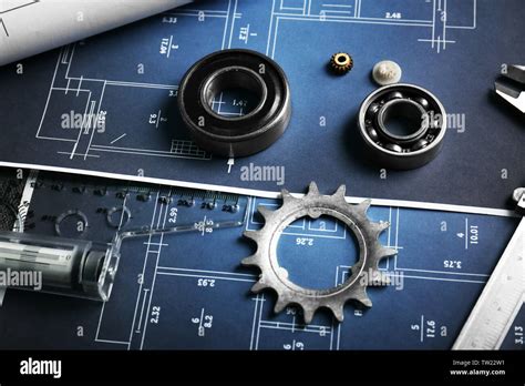 Different kinds of engineering tools on construction drawings background Stock Photo - Alamy