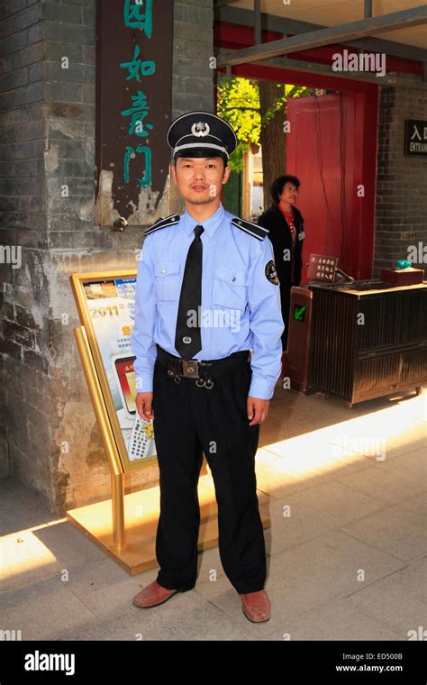 Chinese officer security guard or policeman wearing uniform looking at camera at the Imperial ...