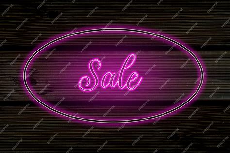 Premium Photo | Sale neon sign on wooden background bright advertising ...