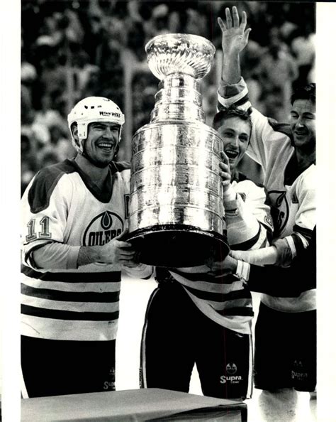 Mark Messier, Wayne Gretzky and Kevin Lowe celebrate their Stanley Cup victory. Lowe is ...