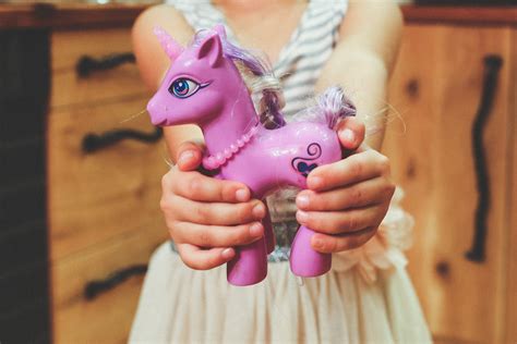 Free Images : hand, purple, kid, horse, child, pink, toy, hold, holding, hands, figurine, skin ...