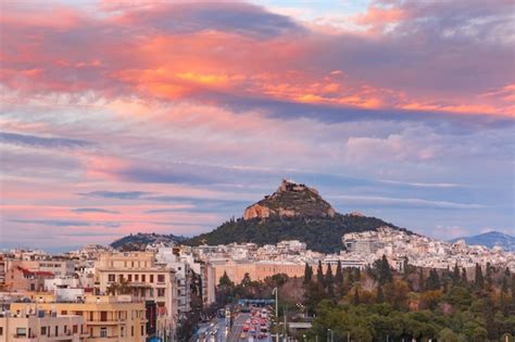 Premium Photo | Mount lycabettus towering above of the roofs of old ...