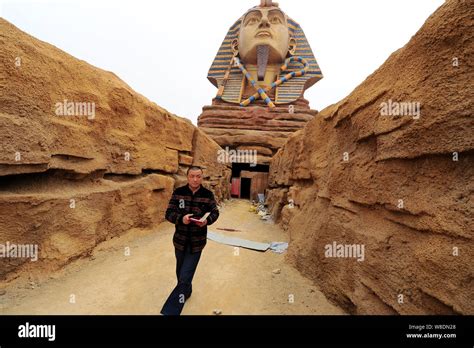 A man exits the chamber inside the replica of the Great Sphinx at the construction site of ...