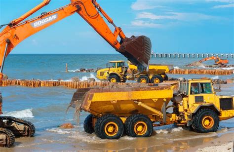 Construction of Breakwaters, Construction Equipment on the Sea Coast Editorial Stock Image ...