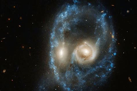 The Sputniks Orbit: Space - Hubble Telescope spots ‘ghostly face’ in colliding galaxies