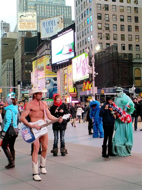 street performers lined up the street in Times Square, New York ...