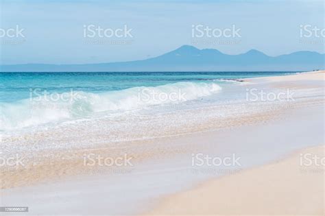 Bali Beach Scene Turquoise Indian Ocean Volcanoes And Clouds On The Background Stock Photo ...