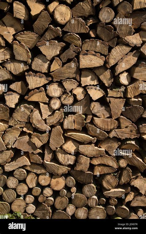 Stack of logs for firewood Stock Photo - Alamy