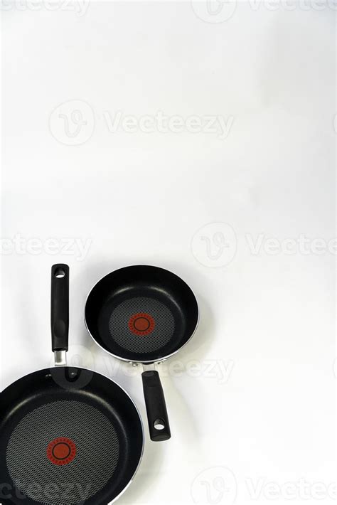 teflon cooking pans, black teflon on white background, plastic handles ...