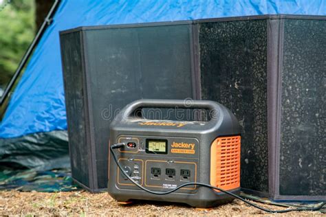 Tent Camping with a Portabable Power Battery and Solar Panel Editorial Image - Image of battery ...