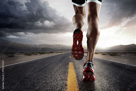 Sports background. Runner feet running on road closeup on shoe. Stock Photo | Adobe Stock