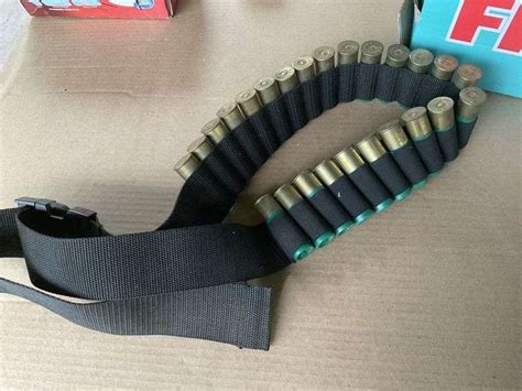 Remington 12 gauge shells with belt - Legacy Auction Company