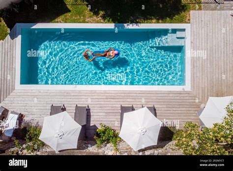 Two person swim in the pool at the hotel. View from above, couple men ...