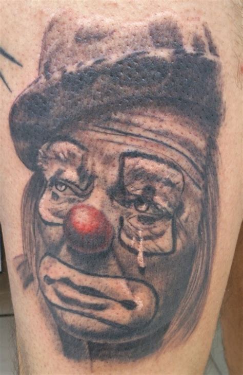 Crying old clown tattoo