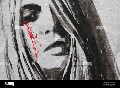 Street Art in Paris representing a sad woman crying blood Stock Photo ...