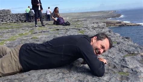 Funny Man Faces His Fear of Heights by Looking Down a Cliff in Ireland