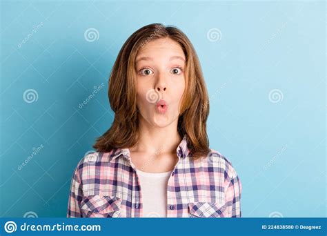 Photo of Charming Shocked School Girl Wear Plaid Shirt Big Eyes Isolated Blue Color Background ...